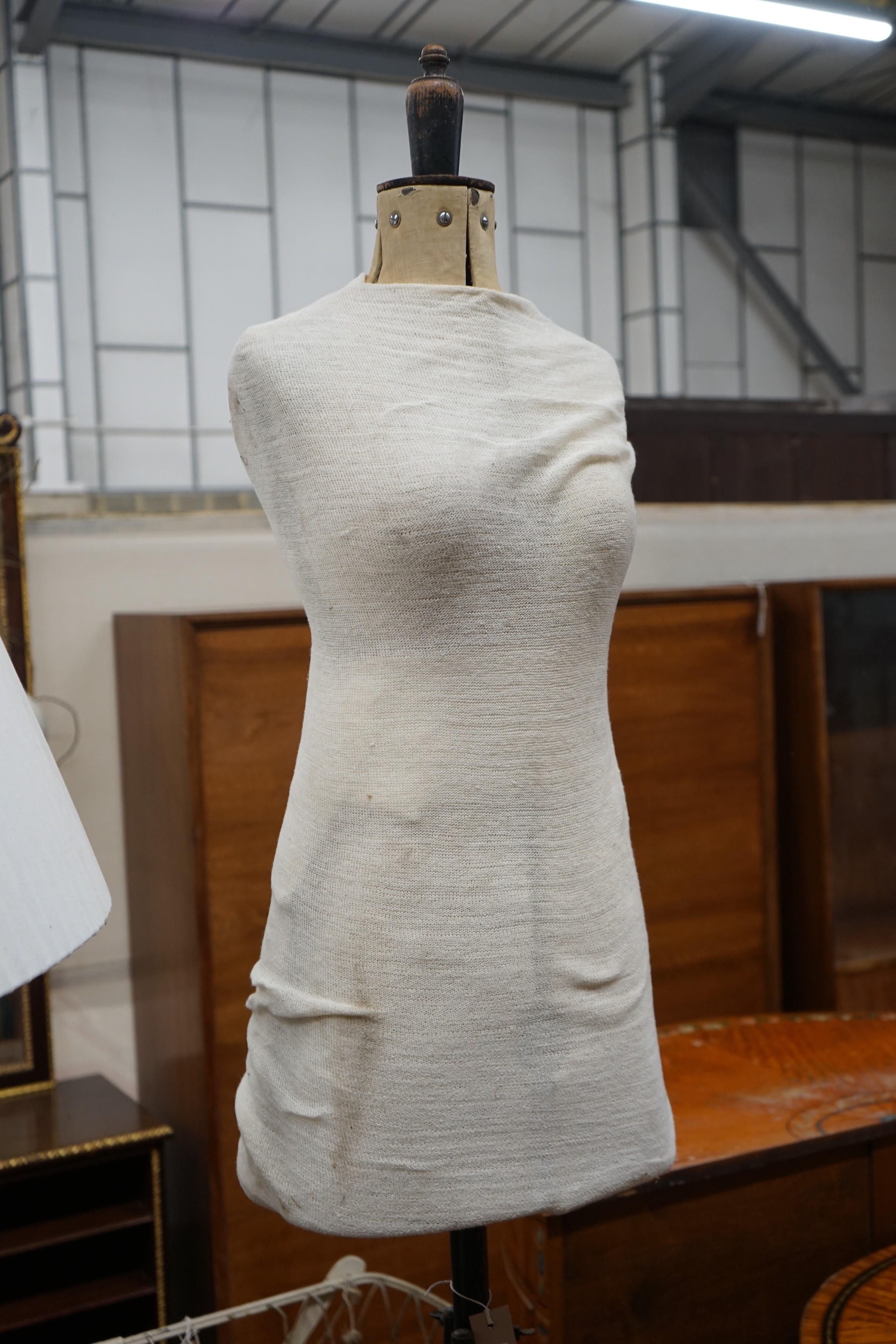 A tailor's dummy, marked 'Child' on wrought iron tripod stand, height 138cm
